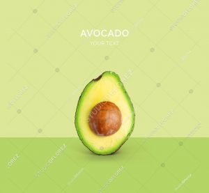 Creative layout made of avocado on the green background. Flat lay. Food concept. Macro  concept.