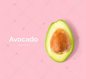 Creative layout made of avocado on the pink background. Flat lay. Food concept.