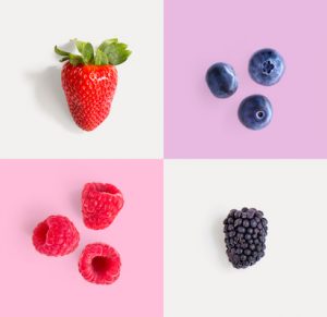 Creative layout made of strawberry, raspberry, blueberry and blackberry. Food concept.
