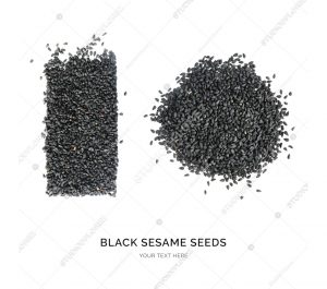 Creative layout made of black sesame seeds on the white background. Flat lay. Food concept. Macro  concept.