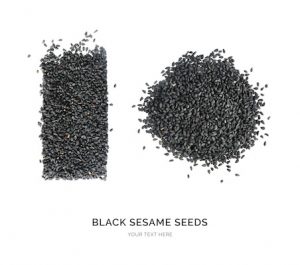 Creative layout made of black sesame seeds on the white background. Flat lay. Food concept. Macro  concept.