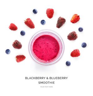 Creative layout made of blackberry and blueberry juice. Flat lay. Food concept. Smoothie on the white background.