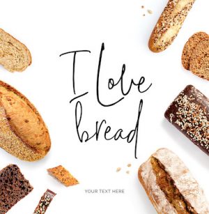 Creative layout made of  quote "I love bread". Flat lay. Food concept. Baguette, white bread, rye bread and slices on the white background.