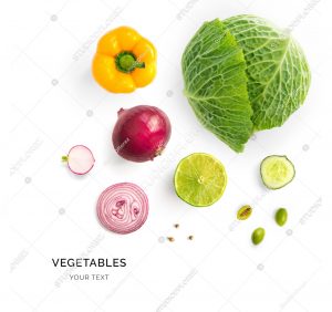 Creative layout made of green cabbage, onion, yellow pepper and lime. Flat lay. Food concept. Vegetables isolated on white background.