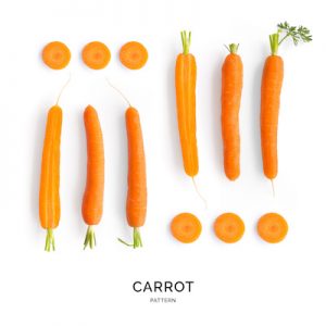 Seamless pattern with carrot. Vegetables abstract background. Carrot on the white background.