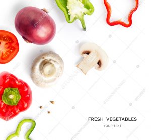 Creative layout made of tomato, red and green pepper, onion and mushroom champignon on the white background. Flat lay. Food concept.