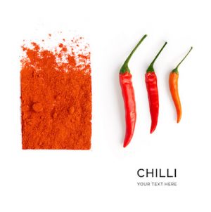 Creative layout made of chilli pepper on the white background. Flat lay. Food concept. Macro  concept.