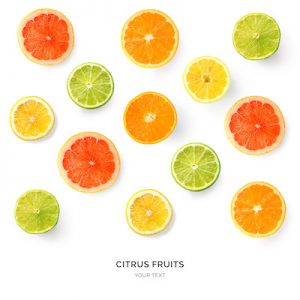 Creative pattern made of lemon, lime, orange and grapefruit. Flat lay. Food concept. Lemon, lime, orange and grapefruit on white background.