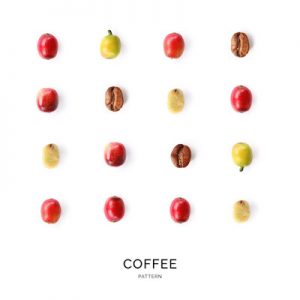 Seamless pattern with coffee beans. Abstract background. Coffee beans on the white background.