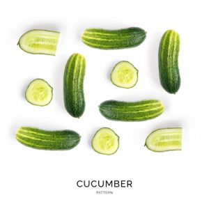 Creative layout made of cucumber on the white background. Flat lay. Food concept.