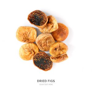 Creative layout made of dried figs on white background.Flat lay. Food concept.