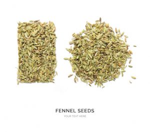 Creative layout made of fennel seeds on the white background. Flat lay. Food concept. Macro  concept.