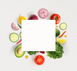Creative layout made of various vegetables with white paper card. Flat lay. Food concept.