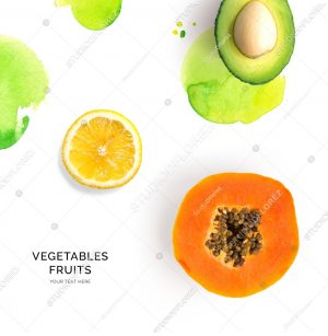 Creative layout made of papaya, avocado and lemon on the white background. Flat lay. Food concept.