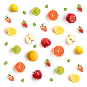 Pattern with grapefruit, strawberry, lime, lemon and apple. Tropical abstract background.  Grapefruit, strawberry, lime, lemon and apple on the white background.