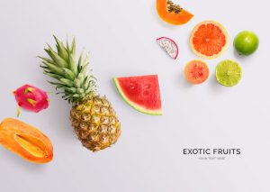 Creative layout made of papaya, pineapple, grapefruit, guava, watermelon, dragon fruit and lime. Flat lay. Food concept.