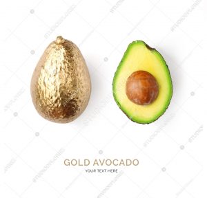 Creative layout made of gold avocado on the white background.  Tropical flat lay. Food concept.