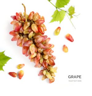 Creative layout made of grape with green leaves on the white background. Flat lay. Food concept.