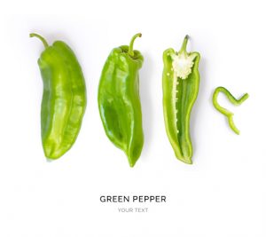 Creative layout made of green pepper. Flat lay. Food concept.