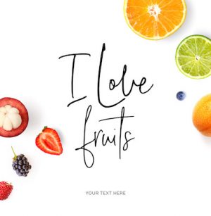 Creative layout made of  quote "I love fruits".  Tropical flat lay. Food concept. Orange, lime, strawberry, blueberry, blackberry and mangosteen on the white background.