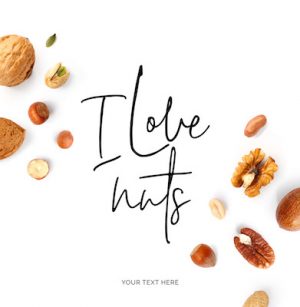 Creative layout made of  quote "I love nuts". Food concept. Hazelnut nuts, almonds, walnut, peanut, pecan, cashew on white background.