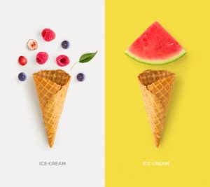 Ice cream cone with raspberry, blueberry and watermelon. Flat lay. Food concept. Abstract background.