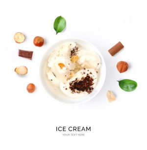 Creative layout made of ice cream and nuts. Flat lay. Food concept. Ice cream and fruits on white background.