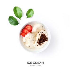 Creative layout made of  ice cream and strawberry. Flat lay. Food concept. Ice cream and fruits on white background.