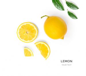 Creative layout made of lemon and leaves. Flat lay. Food concept. Lemon on white background.