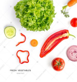 Creative layout made of tomato, onion, red pepper, cucumber and lettuce. Flat lay. Food concept. Vegetables isolated on white background.