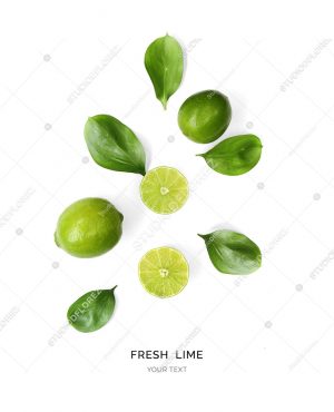 Creative layout made of lime on the white background. Flat lay. Food concept. Macro  concept.