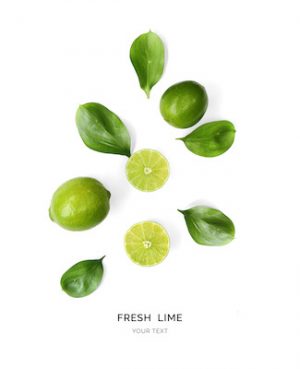 Creative layout made of lime on the white background. Flat lay. Food concept. Macro  concept.