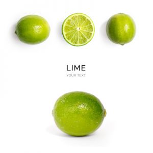 Creative layout made of lime on the white background. Flat lay. Food concept. Macro  concept.