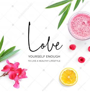 Creative layout made of  quote "Love yourself enough to live a healthy lifestyle".  Tropical flat lay. Food concept. Lemon, raspberry, pink flowers and juice on the white background.