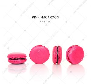 Creative layout made of pink macaroons on the white background. Flat lay. Food concept.
