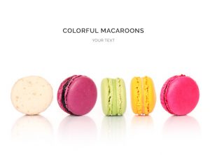 Creative layout made of colorful macaroons on the white background. Flat lay. Food concept.