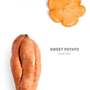 Creative layout made of sweet potato on the white background. Flat lay. Food concept. Macro  concept.