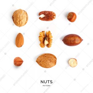 Seamless pattern with nuts. Abstract background. Hazelnut, almond, pecan, walnut  on the white background.