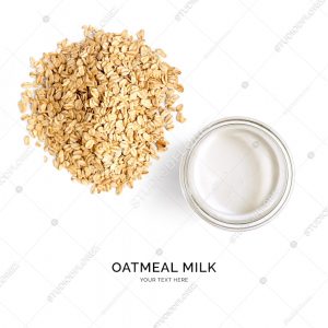 Creative layout made of oatmeal milk on white background. Flat lay. Food concept.