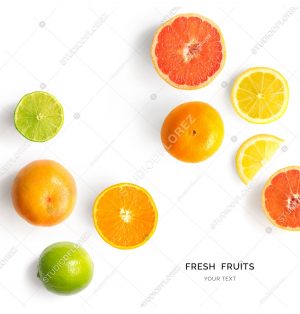 Creative layout made of lemon, lime, orange and grapefruit. Flat lay. Food concept. Lemon, lime, orange and grapefruit on white background.