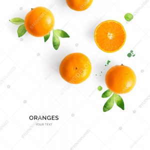 Creative layout made of orange on the watercolor background. Flat lay. Food concept.