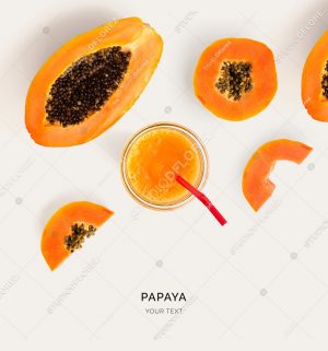 Creative layout made of papaya smoothie. Flat lay. Food concept. Papaya on the light background.