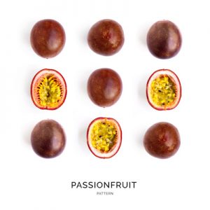 Seamless pattern with passionfruit. Tropical abstract background. Maracuya on the white background.