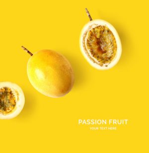 Creative layout made of passion fruit on yellow background. Tropical flat lay. Food concept.
