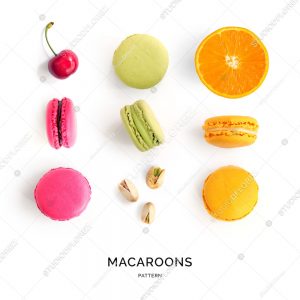Seamless pattern made of colorful macaroons on the white background. Flat lay. Food concept.