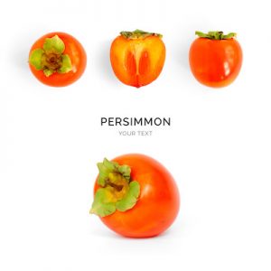 Creative layout made of persimmon on the white background. Food concept. Macro concept.