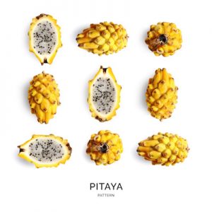 Seamless pattern with pitaya on the white background. Flat lay. Food concept.