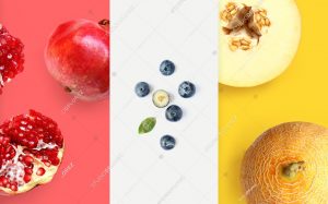 Creative layout made of pomegranate, blueberry and melon. Flat lay. Food macro concept.
