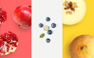 Creative layout made of pomegranate, blueberry and melon. Flat lay. Food macro concept.