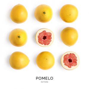 Seamless pattern with pomelo. Tropical abstract background. Pomelo on the white background.